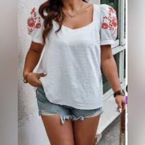 White Puff Sleeve Top with bright Orange Embroidery Women’s size Medium like new